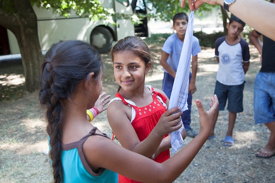 Roma young girls participating in games at summer camps organised by Swiss-supported project.
