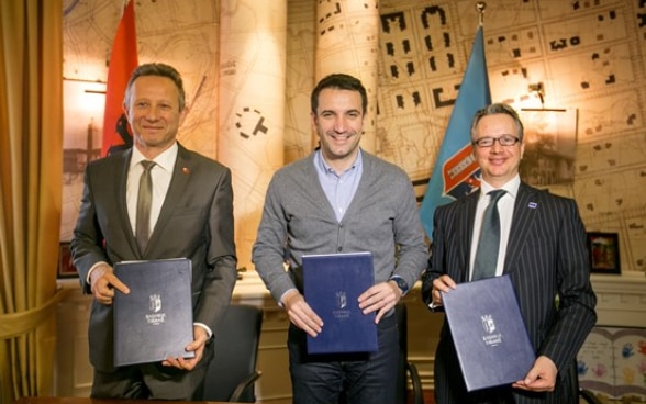 Swiss Ambassador Graf with Tirana Mayor Erion Veliaj and Council of Europe representative Claus Neukirch after signing memorandum on direct democracy