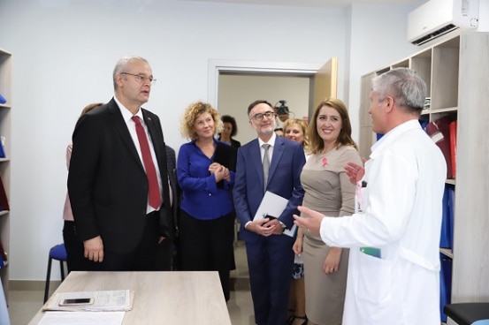 Swiss Ambassador Adrian Maître and Albania's Minister of Health Ogerta Manastirlliu visiting the renovated health centre in Lushnje