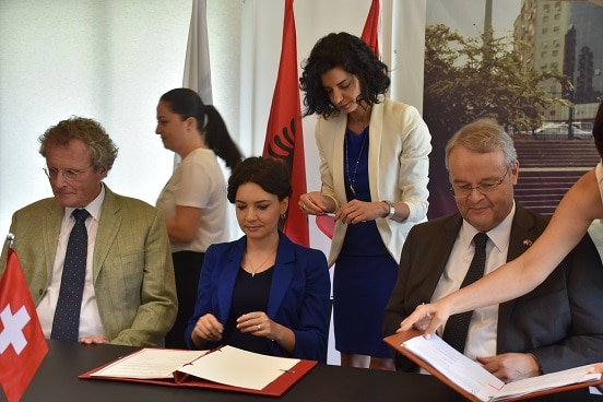 Signing of agreement in support of Albania's Parliament. From left: Head of OSCE Presence in Albania, Bernd Borchardt; Minister for Relations with Parliament Elisa Spiropali; Swiss Ambassador in Albania Adrian Maître. 