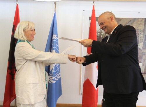 UN Resident Coordinator in Albania Fiona McCluney and Swiss Ambassador Adrian Maître after signing agreement on supporting social protection in Albania.