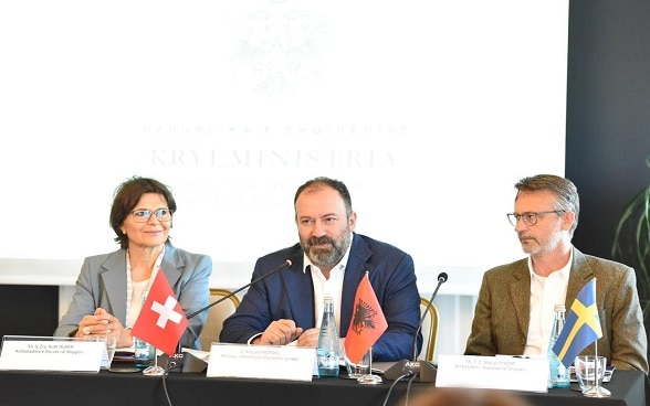 Swiss Ambassador Ruth Huber (left) with Minister of State for Local Governance Arbjan Mazniku (centre) and Swedish Ambassador Niklas Ström at the signing event.
