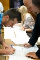 Image of a ceremony of distributing certificates for local community and municipal representatives