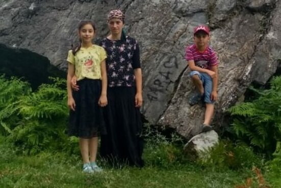 Mother with her kids posing for a photo