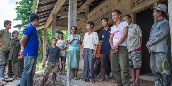 Villagers, local authorities and project staff discuss new primary school construction progress in Luang Prabang, Lao PDR.