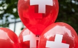 red balloons with a white cross