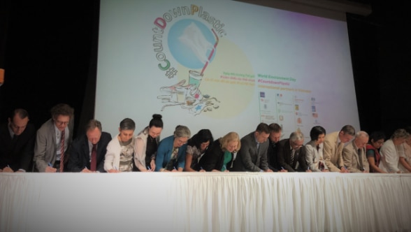 Ambassador Beatrice Maser Mallor (the 4th from the left), together with the 40 international partners, signing the Code of Conduct