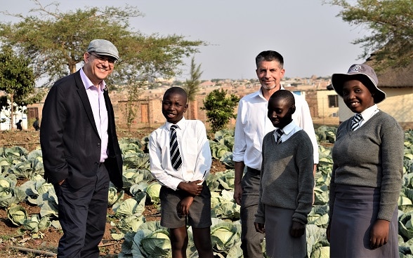 A high level delegation from the Swiss Agency for Development and Cooperation including the Deputy Director, Thomas Gass and the Head of the Eastern and Southern Africa Division, Peter Bieler are shown the garden at Blackfordby Primary School in Harare South, Zimbabwe.