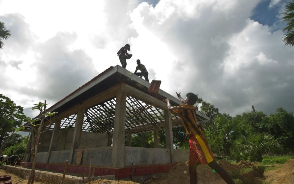 Sri Lankans working on the construction site of a new house.