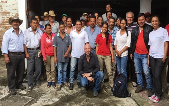 Giuseppe Rullanti poses with a group of villagers.