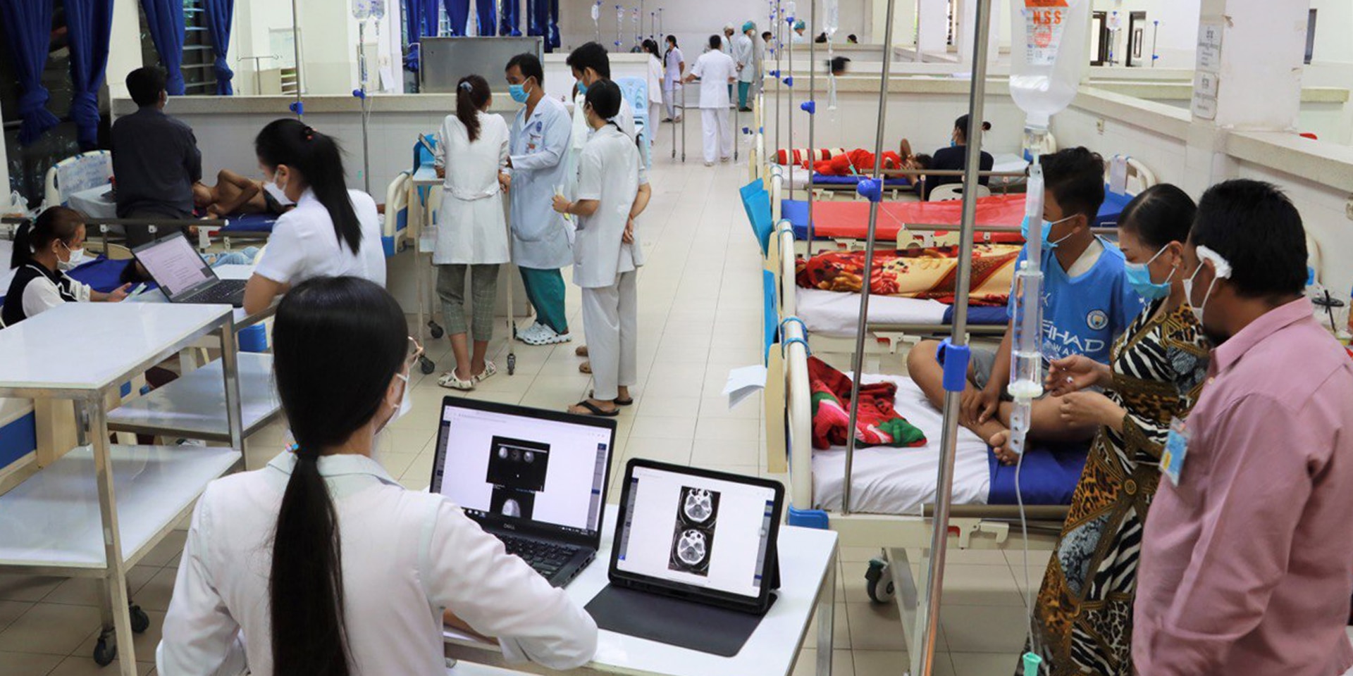  A ward in a Kantha Bopha children's hospital filled with patients and carers. 