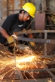 A young man welding in Nepal.
