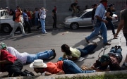 Supporters of the deposed president José Manuel Zelaya coming under fire from the Honduran army in 2009