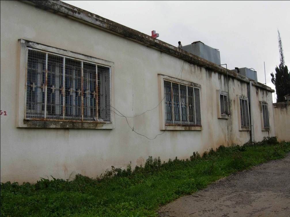 The dilapidated exterior of a school building.