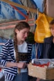 The photo shows the Senaki vegetable market vendor weighing tomatoes brought by Medea and her father.
