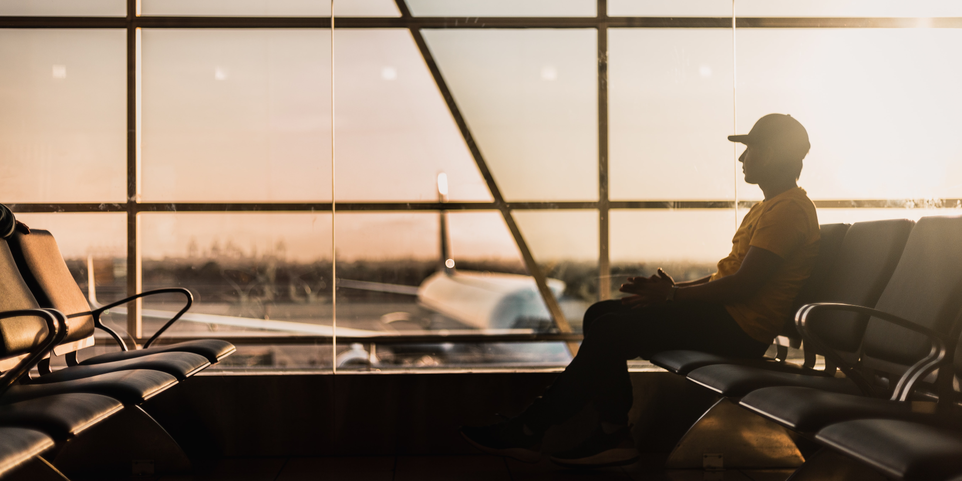 Man at airport waiting for a flight.