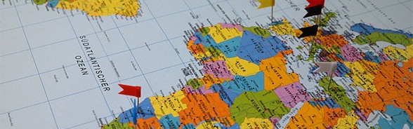 World map with little flags marking destinations