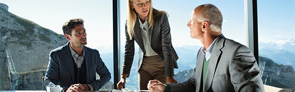 Professionals around a table at a meeting