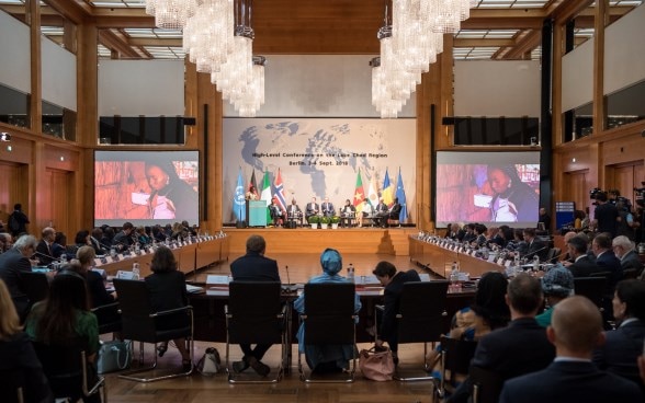 Participants of the Lake Chad Conference sit in a conference room at the Federal Foreign Office in Berlin. 