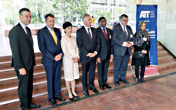 Federal Councillor Didier Burkhalter stands for a group photo with six other participants of the Conference of States Parties to the Arms Trade Treaty.