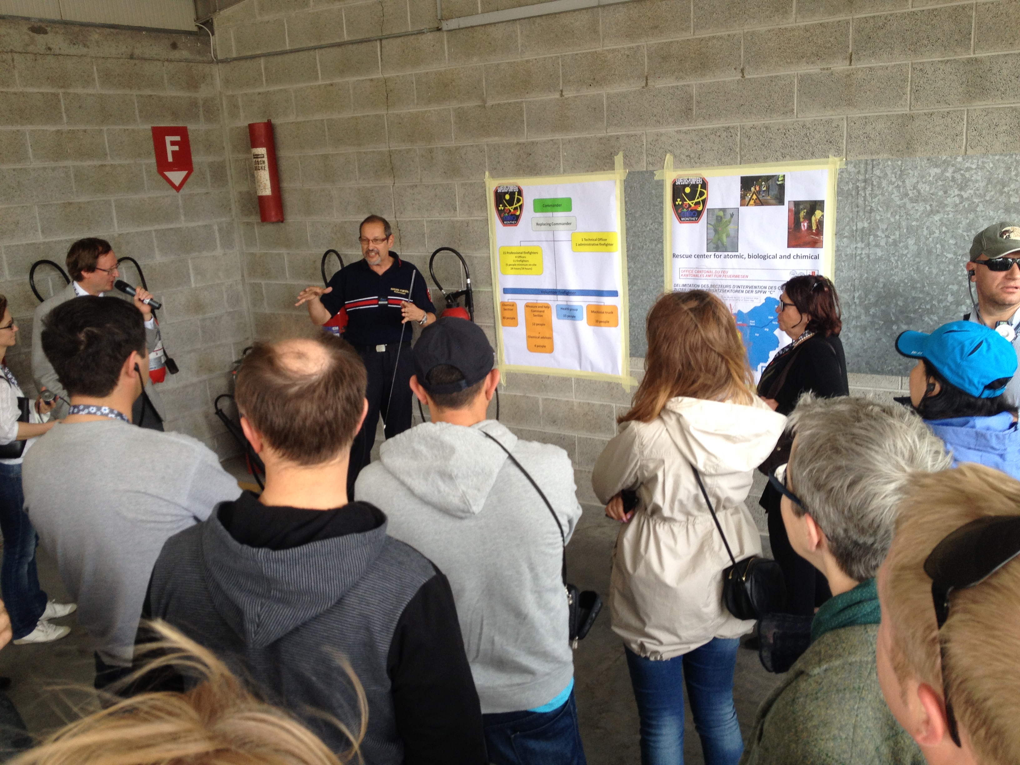 Excursion participants at a presentation of protection measures against natural hazards on chemical sites