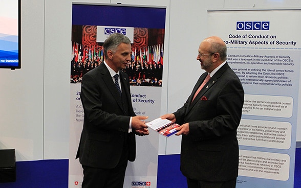 Didier Burkhalter, Chairperson-in-Office of the OSCE 2014 and President of the Swiss Confederation  solemnly hands over the Commemorative Publication to Lamberto Zannier, OSCE Secretary General