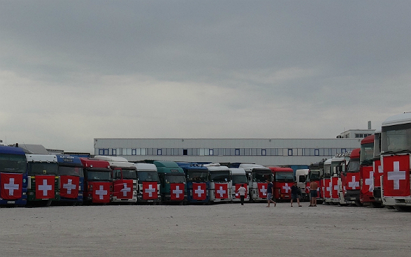 85 lorries parked alongside one another before setting off.
