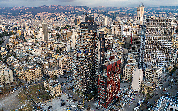 Aerial view of destroyed apartments and office buildings. 