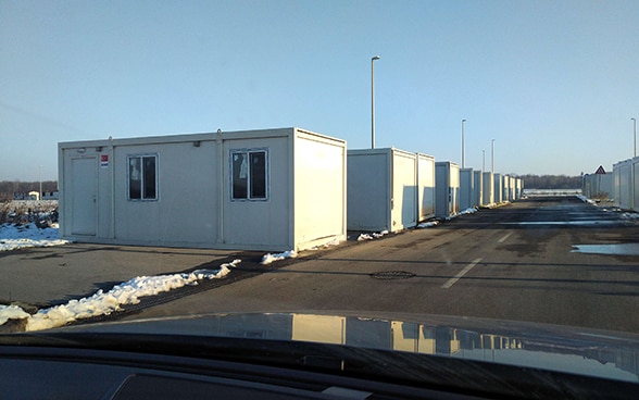 A row of containers serving as emergency housing.