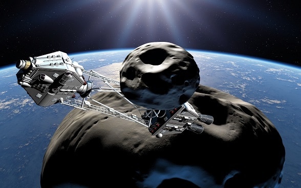 Photomontage d’un astéroïde capturé et amené en orbite terrestre pour en exploiter les ressources naturelles.