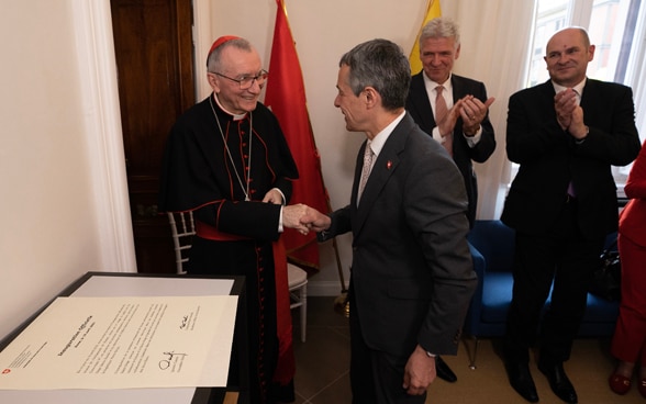 Federal Councillor Ignazio Cassis and Cardinal Pietro Parolin during the inauguration of the Swiss Embassy to the Holy See.