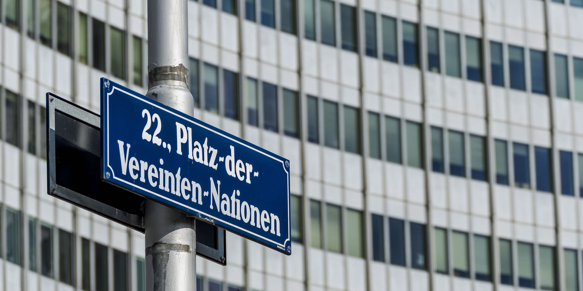 A plaque in front of the UN building in Vienna reads "United Nations Square".