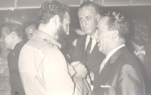 Emil A. Stadelhofer (right) speaking with Fidel Castro, 1964.