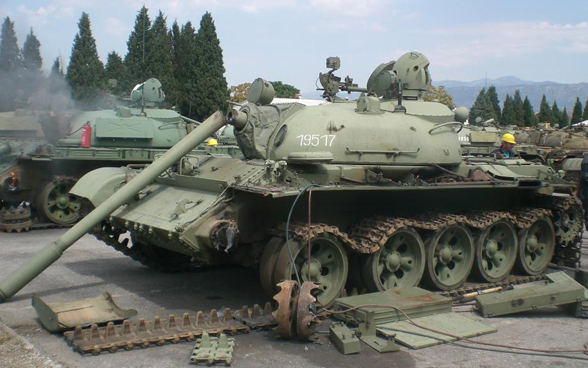 A tank with its main gun broken. The tracks and other parts have also been removed. 