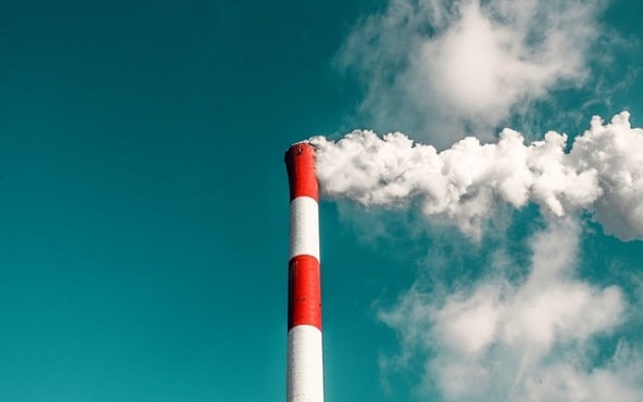 An industrial chimney emitting smoke.