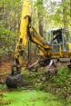 An excavator in the woods