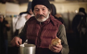 A homeless man having a meal in Bratislava
