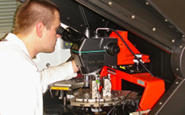 A young doctoral student at work in the laboratory.  